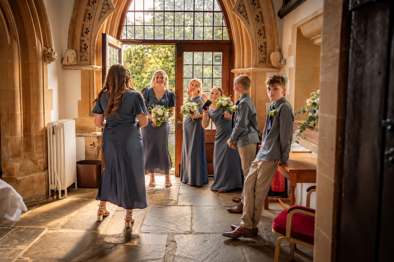 Sunlit-Stone-Chapel-Wedding-Entrance